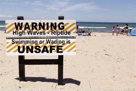 Beach hazard warning extended after man and girl are swept out to sea